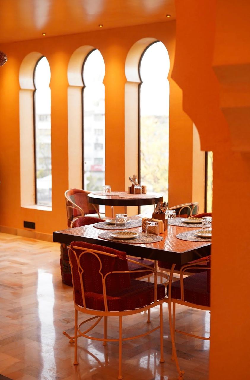 Dining area with elegant orange arches